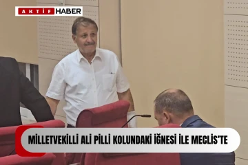 Güzelyurt Milletvekili Ali Pilli Meclis'e kolundaki iğnesi ile geldi.